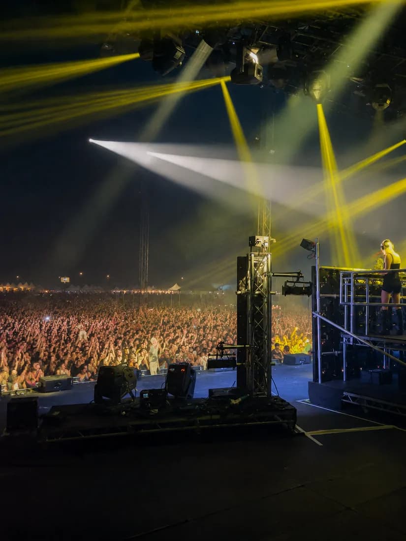 Jo Whiley performing, viewed from side of stage