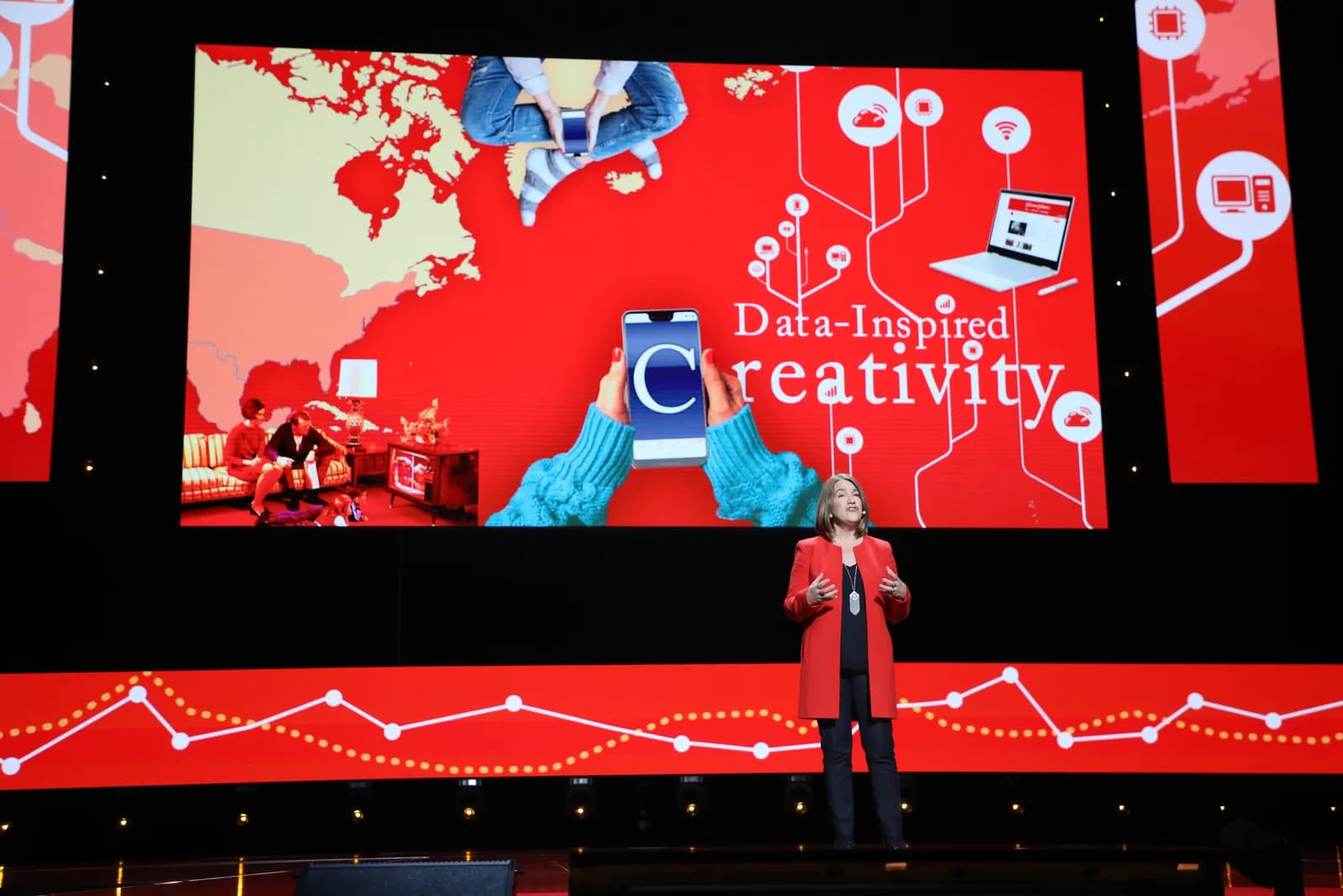 A large presentation screen supported by technical event production