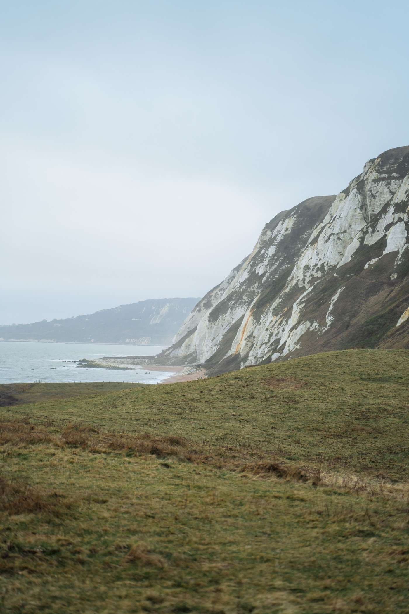 Chalk cliffs above a quiet stretch of coastline
