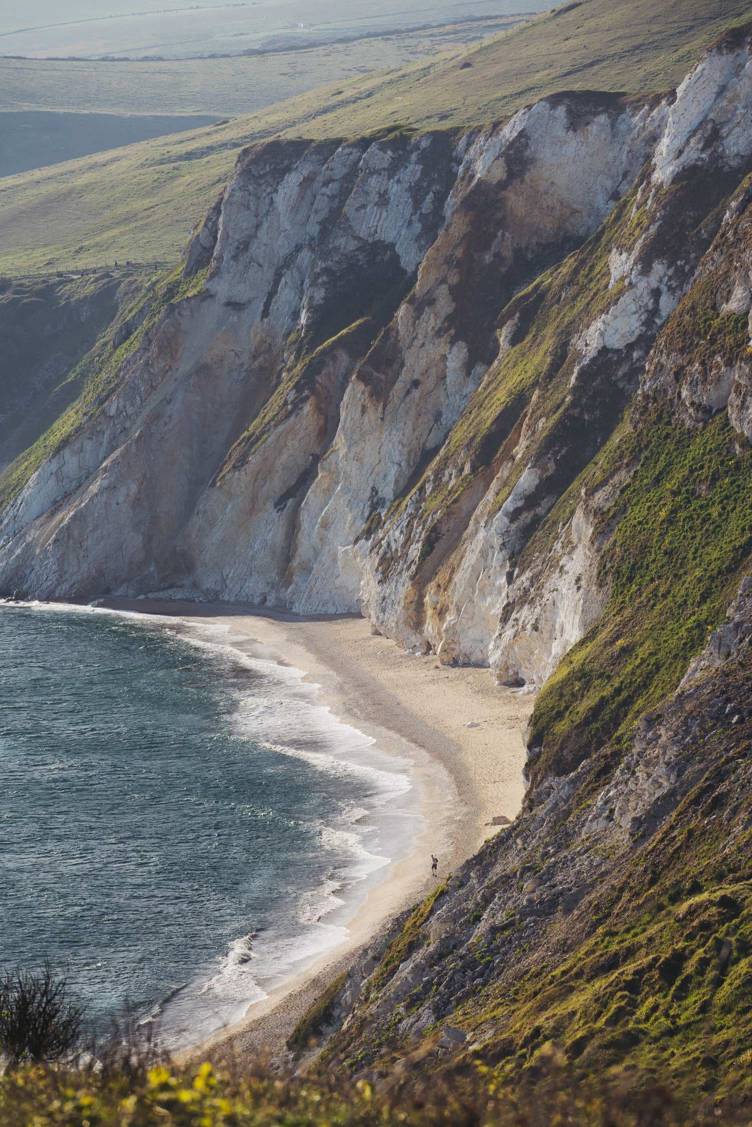 Chalk cliffs and a private cove on the Isle of Wight coast