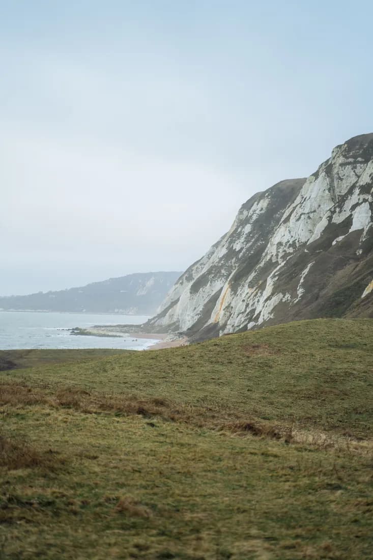 A secluded Isle of Wight beach beneath wooded cliffs